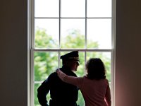 New New Bedford Police Chief Joseph C. Cordeiro and his sister Terry Larson enjoy a quiet emotional moment together "wishing our parents were here to see this moment" before Mr. Cordeiro was sworn in at the Whaling Museum.   PETER PEREIRA/THE STANDARD-TIMES/SCMG